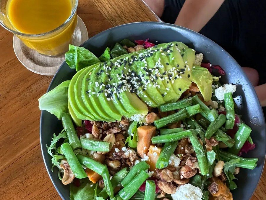 A bright green salad bowl at Chela in Bingin.